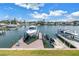 This backyard has boat lifts providing direct access to the waterfront and surrounding waterways at 100 Windrush Blvd # 1, Indian Rocks Beach, FL 33785