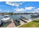 This backyard has boat lifts providing direct access to the waterfront and surrounding waterways at 100 Windrush Blvd # 1, Indian Rocks Beach, FL 33785