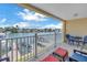 Enjoy waterfront views from this condo's balcony, complete with seating and scenic surroundings at 100 Windrush Blvd # 1, Indian Rocks Beach, FL 33785