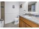 Bathroom featuring granite countertop, neutral cabinet and tile at 100 Windrush Blvd # 1, Indian Rocks Beach, FL 33785