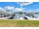 Water view showing multiple boat docks with lifts, providing easy access to the water for boating and recreation at 100 Windrush Blvd # 1, Indian Rocks Beach, FL 33785
