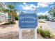 Entrance sign for The Landings At Windrush, enhancing curb appeal and community branding at 100 Windrush Blvd # 1, Indian Rocks Beach, FL 33785