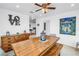 Open dining area with farmhouse table and modern decor at 100 Windrush Blvd # 1, Indian Rocks Beach, FL 33785