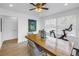 Dining room with natural light and a wood table, accompanied by a painting on the wall at 100 Windrush Blvd # 1, Indian Rocks Beach, FL 33785