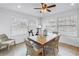 Dining area with natural light, a modern table, seating and Peloton exercise bike at 100 Windrush Blvd # 1, Indian Rocks Beach, FL 33785