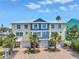 Beautiful townhomes with bright, colorful facades and private garages in a tropical setting at 100 Windrush Blvd # 1, Indian Rocks Beach, FL 33785