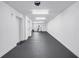 Spacious garage with clean white walls and a sealed gray floor, offering ample storage and functional space at 100 Windrush Blvd # 1, Indian Rocks Beach, FL 33785