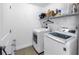 Functional laundry room includes a modern washer and dryer for convenient laundry care at 100 Windrush Blvd # 1, Indian Rocks Beach, FL 33785