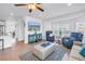 Bright living room featuring comfortable seating, modern decor and kitchen views at 100 Windrush Blvd # 1, Indian Rocks Beach, FL 33785