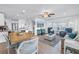 Open concept living room with a view of the kitchen and dining area at 100 Windrush Blvd # 1, Indian Rocks Beach, FL 33785