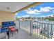 Balcony with seating overlooking the marina, perfect for outdoor relaxation and waterfront views at 100 Windrush Blvd # 1, Indian Rocks Beach, FL 33785