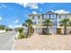 Inviting townhome community with colorful exteriors, brick driveways, and lush landscaping, perfect for a vibrant neighborhood at 100 Windrush Blvd # 1, Indian Rocks Beach, FL 33785