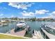 Scenic waterfront view with a private boat lift, ideal for boating enthusiasts at 100 Windrush Blvd # 1, Indian Rocks Beach, FL 33785