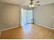 Bedroom with hardwood floors and view of the patio at 1001 77Th N Ave # 206, St Petersburg, FL 33702