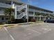 Exterior view of building with parking spots and visible stairs at 1001 77Th N Ave # 206, St Petersburg, FL 33702