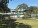 Community pool with plenty of space and palm trees at 1001 77Th N Ave # 206, St Petersburg, FL 33702