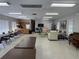 Spacious community room featuring a kitchen, lounge area, tables, and comfortable seating at 1001 77Th N Ave # 206, St Petersburg, FL 33702