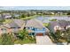An aerial view of a beautiful home, showcasing its surroundings with a pond nearby at 10017 Smarty Jones Dr, Ruskin, FL 33573