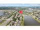 Aerial view of a neighborhood with a community lake, marked with a house icon at 10017 Smarty Jones Dr, Ruskin, FL 33573