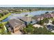 Beautiful aerial view of lakeside homes featuring well-manicured lawns and community amenities at 10017 Smarty Jones Dr, Ruskin, FL 33573