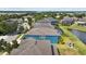 A high-angle view of backyard with a pond and landscaping featuring a patio set at 10017 Smarty Jones Dr, Ruskin, FL 33573