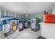 Fun ' bedroom with dual playhouse beds and a charming chandelier at 10017 Smarty Jones Dr, Ruskin, FL 33573