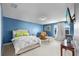 Bright bedroom featuring carpet floors, a comfortable bed, and windows at 10017 Smarty Jones Dr, Ruskin, FL 33573