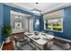Dining room with a modern table and stylish chairs, complemented by a chic light fixture and decor at 10017 Smarty Jones Dr, Ruskin, FL 33573