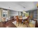 Elegant dining room featuring a grand table, chairs, chandelier, and hardwood floors at 10017 Smarty Jones Dr, Ruskin, FL 33573