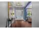 Welcoming foyer with hardwood floors, elegant lighting, and stylish decor at 10017 Smarty Jones Dr, Ruskin, FL 33573