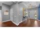 Elegant foyer with high ceilings, wood floors, stylish mirror, and views of the front entry at 10017 Smarty Jones Dr, Ruskin, FL 33573