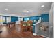 Spacious game room with a pool table, seating area, and hardwood floors at 10017 Smarty Jones Dr, Ruskin, FL 33573