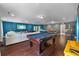 This game room has a pool table and features a sofa and game table at 10017 Smarty Jones Dr, Ruskin, FL 33573