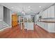 Bright kitchen with white cabinets, granite countertops, stainless appliances, and open layout at 10017 Smarty Jones Dr, Ruskin, FL 33573