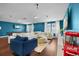 Spacious living room with a pool table, hardwood floors, and comfortable seating at 10017 Smarty Jones Dr, Ruskin, FL 33573