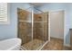This bathroom features a tiled shower with a glass enclosure and rainfall shower head at 10017 Smarty Jones Dr, Ruskin, FL 33573