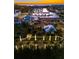 Aerial view of the marina and surrounding area at dusk, showing the waterway and neighborhood at 1025 Seagrape Dr, Ruskin, FL 33570