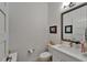 This half bathroom features modern fixtures and beach themed decorations at 1025 Seagrape Dr, Ruskin, FL 33570