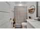 Well-lit bathroom with decor, storage, decorative shower curtain, vanity at 1025 Seagrape Dr, Ruskin, FL 33570