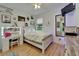 Bright bedroom featuring decor, natural light, and hardwood floors at 1025 Seagrape Dr, Ruskin, FL 33570