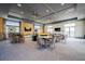 Large common area features multiple seating areas, tables, and TVs for residents at 1025 Seagrape Dr, Ruskin, FL 33570