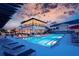 Community pool with lounge chairs and a two-story clubhouse in the background at 1025 Seagrape Dr, Ruskin, FL 33570