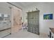 Bright foyer with white tiled floors, a staircase, and a decorative cabinet with charming details at 1025 Seagrape Dr, Ruskin, FL 33570