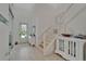 Bright foyer features beautiful tile flooring, a staircase and an open floor plan at 1025 Seagrape Dr, Ruskin, FL 33570