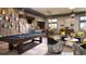 Game room features a pool table, comfortable seating, and a kitchenette area at 1025 Seagrape Dr, Ruskin, FL 33570