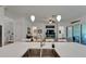 Open-concept kitchen with quartz counters flowing to the living room at 1025 Seagrape Dr, Ruskin, FL 33570