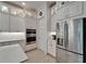 Modern kitchen with stainless steel appliances, plenty of storage, and quartz countertops at 1025 Seagrape Dr, Ruskin, FL 33570