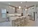 Spacious kitchen with stainless steel appliances, quartz countertops, and ample cabinet space at 1025 Seagrape Dr, Ruskin, FL 33570