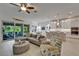 Bright living room and kitchen area with sliding doors to the outdoor patio at 1025 Seagrape Dr, Ruskin, FL 33570