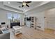 Spacious living room with hardwood floors, a ceiling fan, and natural lighting at 1025 Seagrape Dr, Ruskin, FL 33570